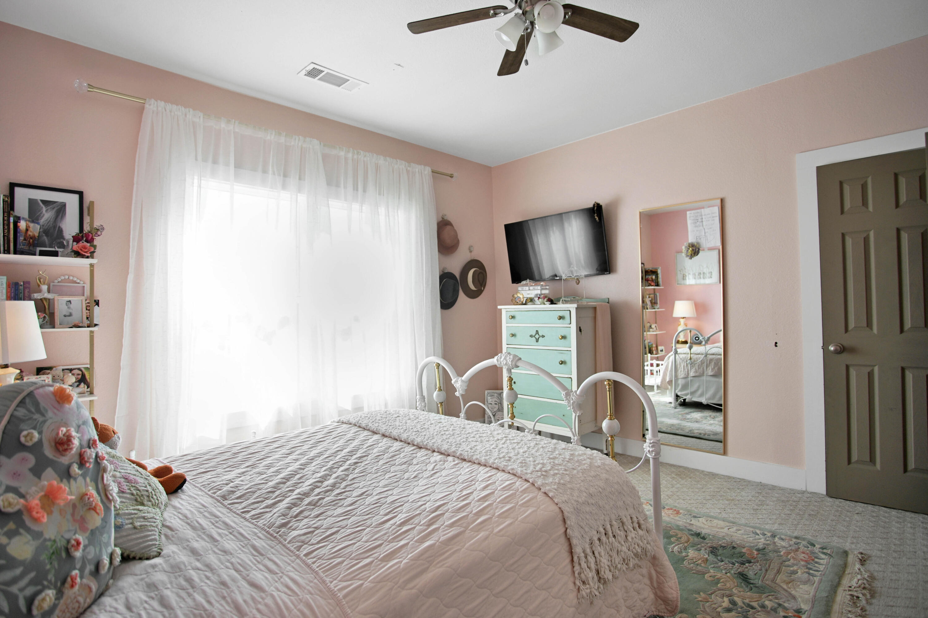 3091 County Road 3 Slaton, TX 79364 - Photo 25 of 41 a bedroom with a bed and a flat screen tv