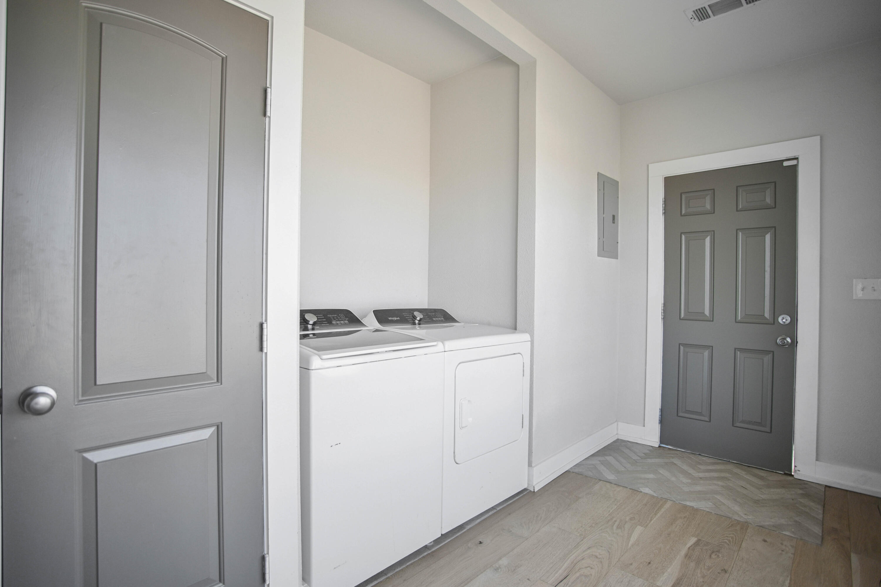 3091 County Road 3 Slaton, TX 79364 - Photo 32 of 41 a view of storage and utility room with washer and dryer