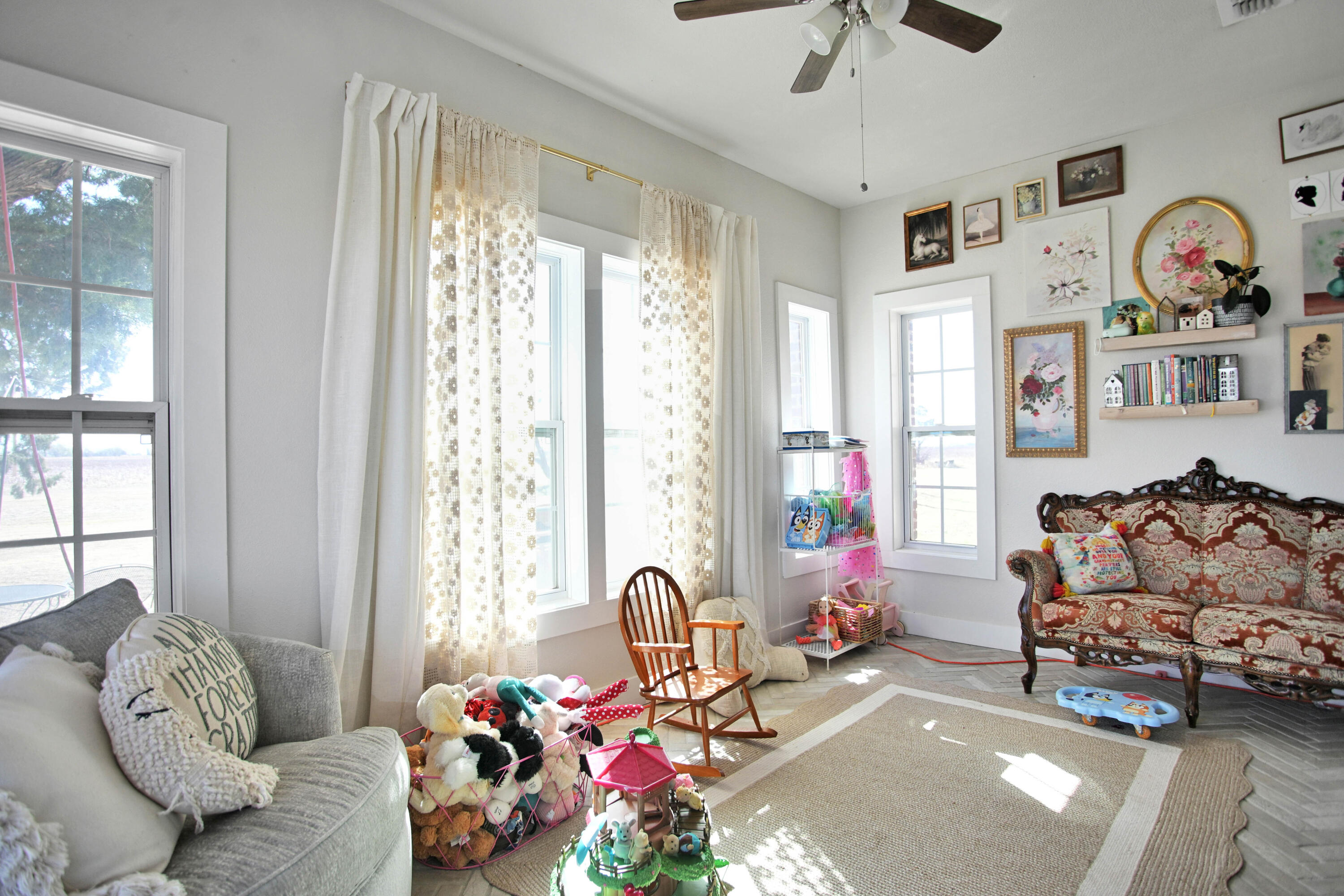 3091 County Road 3 Slaton, TX 79364 - Photo 8 of 41 a living room with furniture toys and a large window