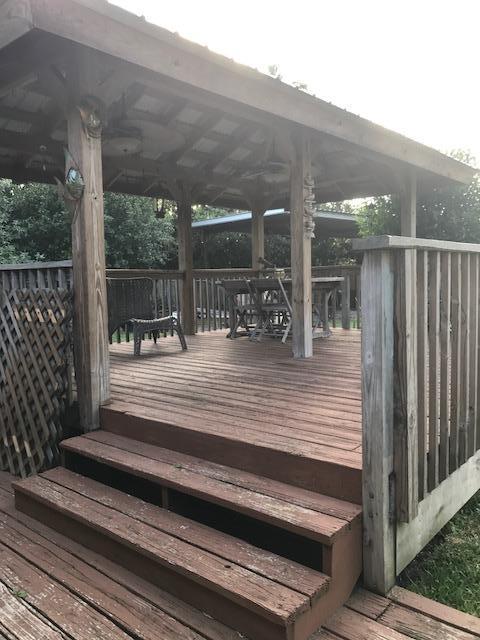 2245 Bacom Point Road Pahokee, FL 33476 - Photo 12 of 24 Back Lot Home Covered Wooden Deck