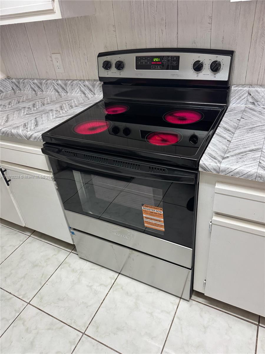 4341 West McNab Road, Unit 27 Pompano Beach, FL 33069 - Photo 17 of 50 a stove top oven sitting inside of a kitchen
