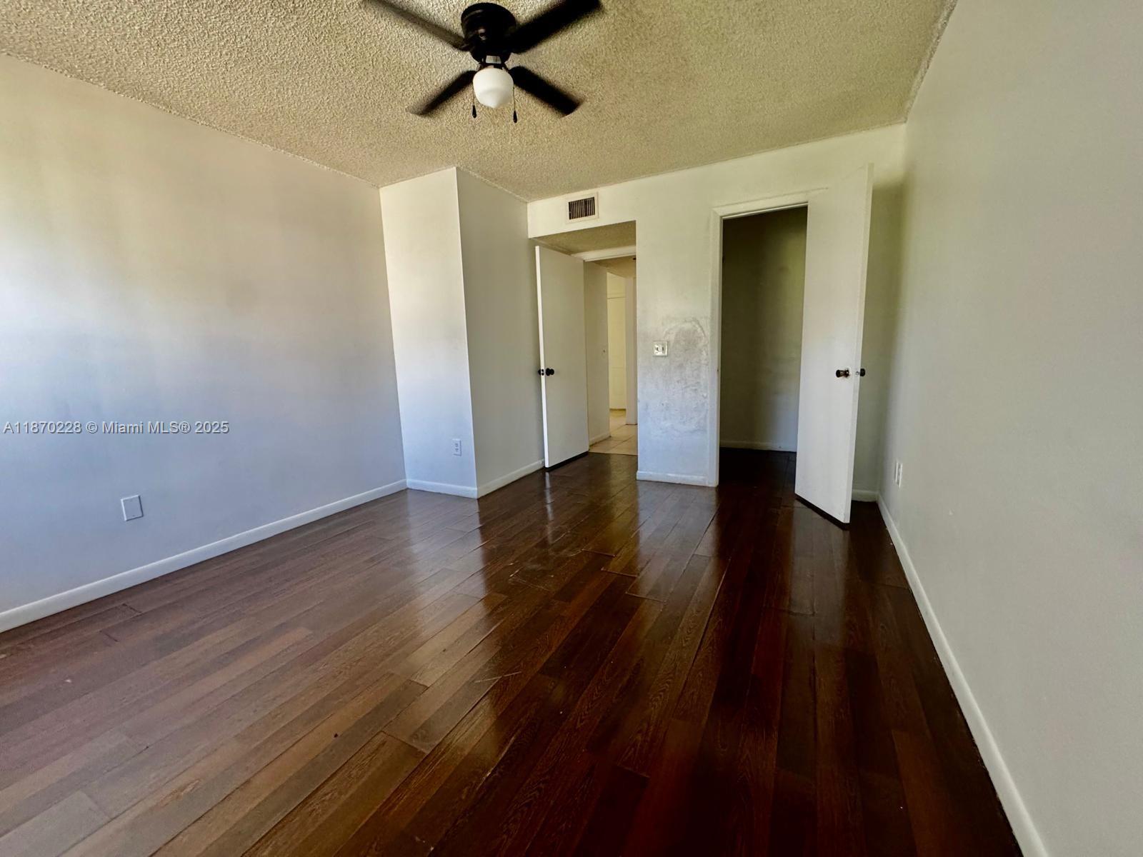 4341 West McNab Road, Unit 27 Pompano Beach, FL 33069 - Photo 18 of 50 a view of a hallway with wooden floor and closet
