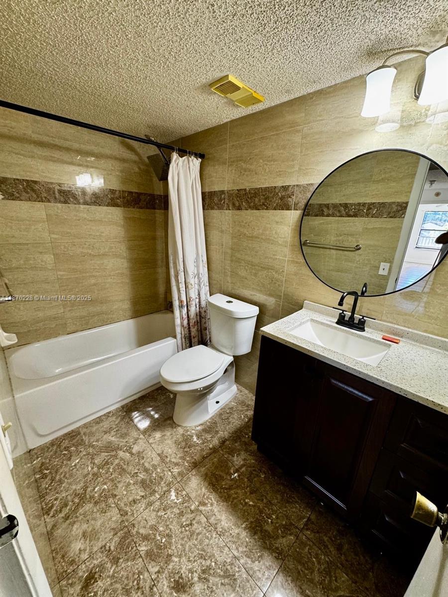4341 West McNab Road, Unit 27 Pompano Beach, FL 33069 - Photo 34 of 50 a bathroom with a sink and a mirror
