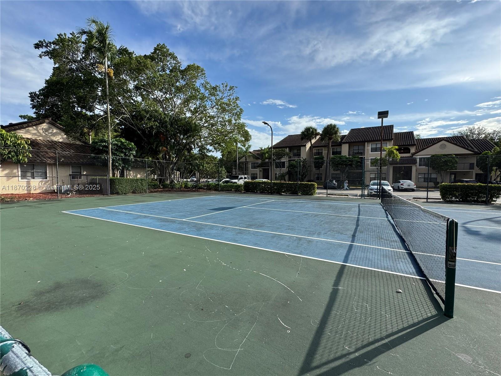 4341 West McNab Road, Unit 27 Pompano Beach, FL 33069 - Photo 4 of 50 a view of a tennis court