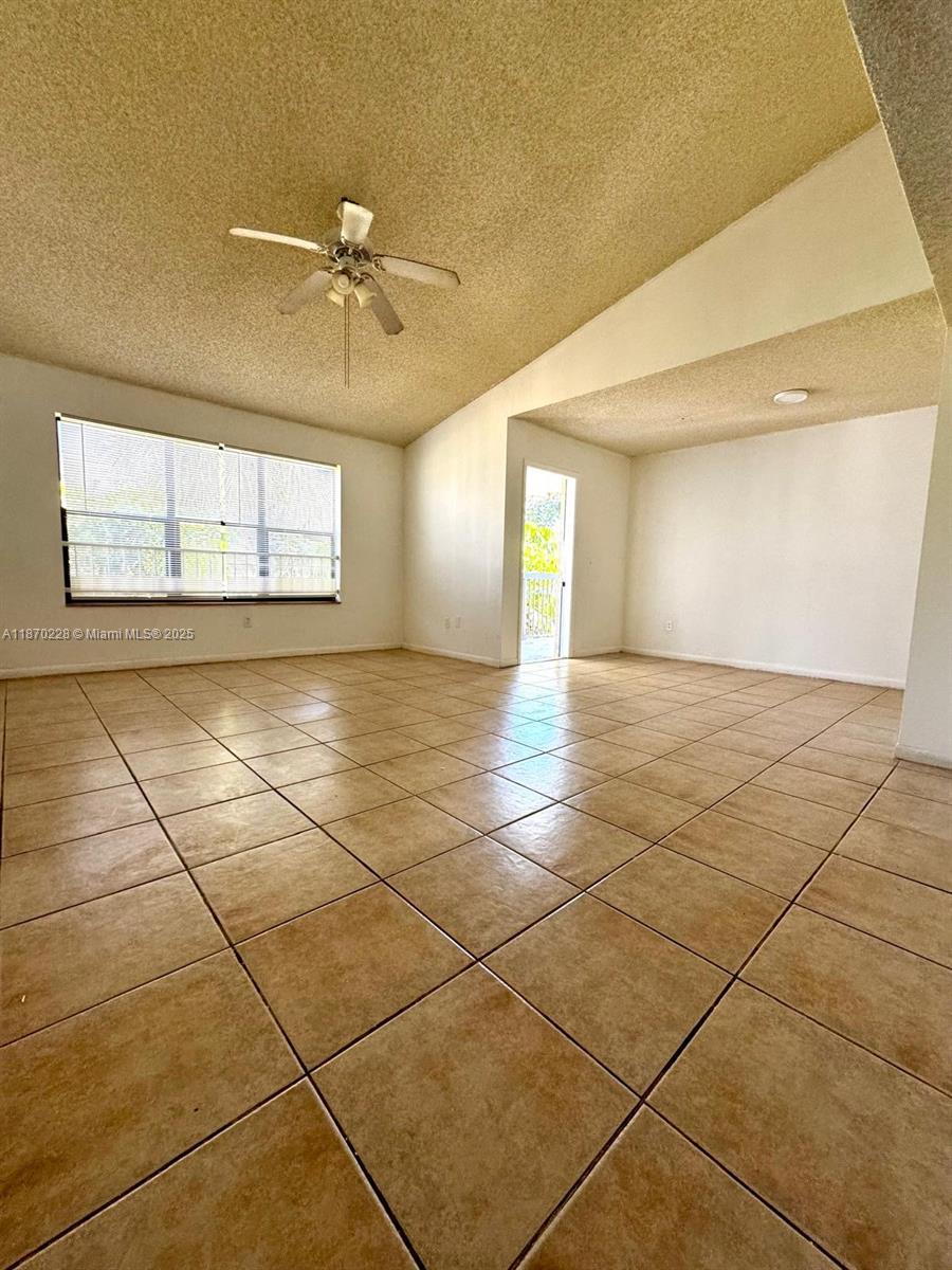 4341 West McNab Road, Unit 27 Pompano Beach, FL 33069 - Photo 47 of 50 a view of a livingroom with a fan and a window