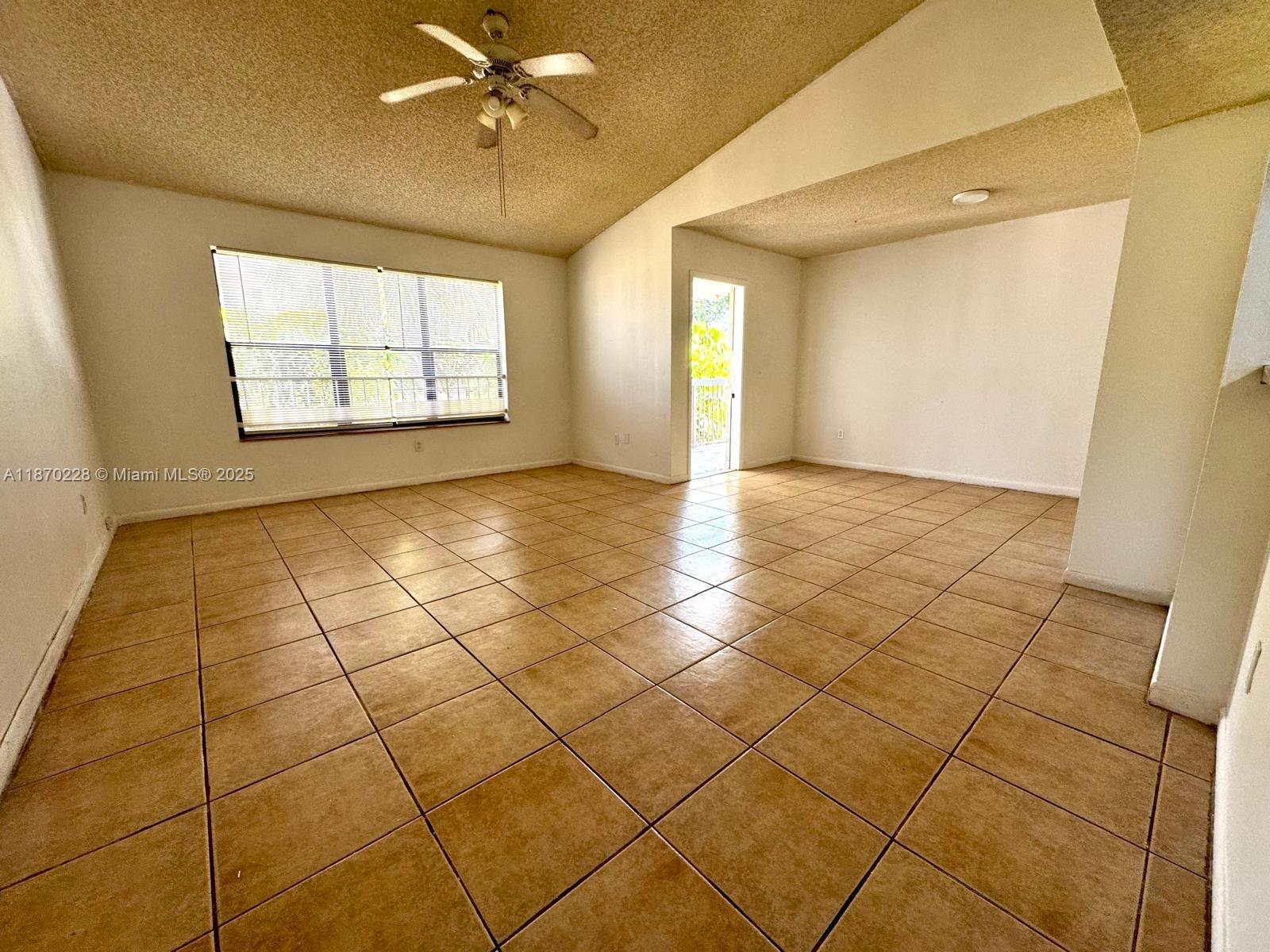 4341 West McNab Road, Unit 27 Pompano Beach, FL 33069 - Photo 50 of 50 a view of an empty room with a window