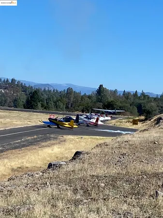 a view of outdoor space with trees all around