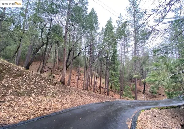 a view of a balcony with wooden floor and outdoor seating