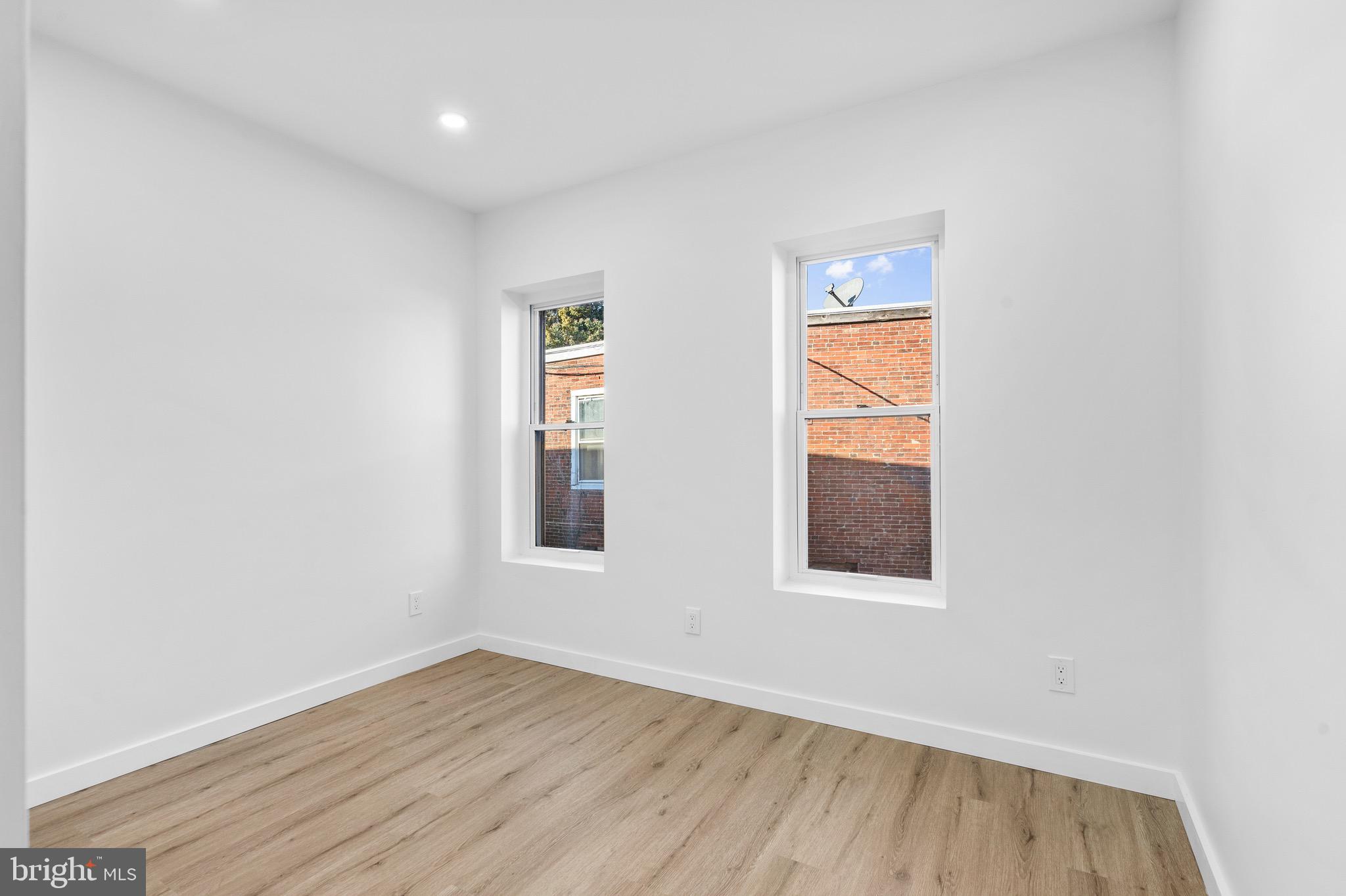 5541 Race Street Philadelphia, PA 19139 - Photo 14 of 37 an empty room with wooden floor and windows
