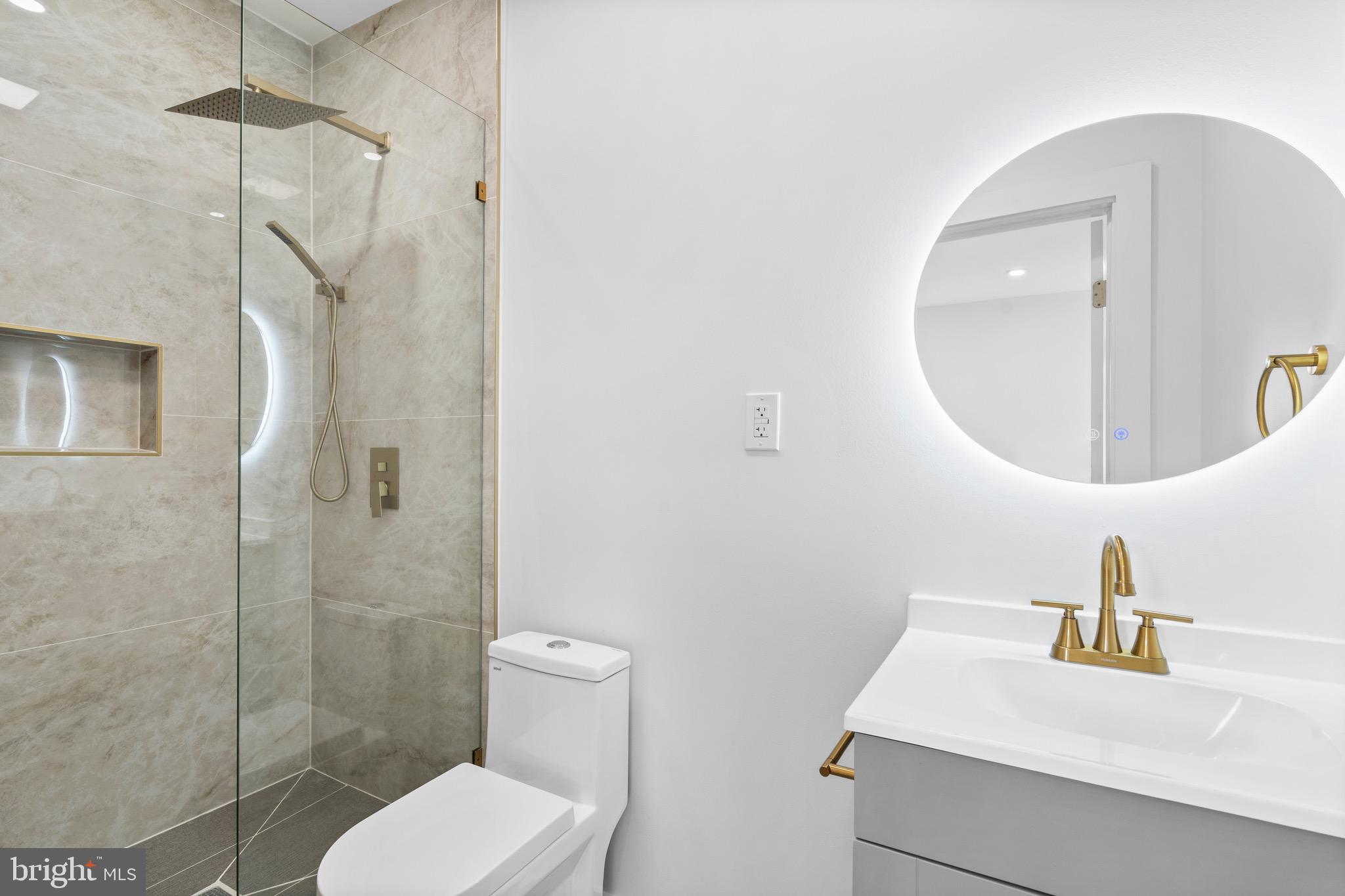 5541 Race Street Philadelphia, PA 19139 - Photo 18 of 37 a bathroom with a toilet sink and shower