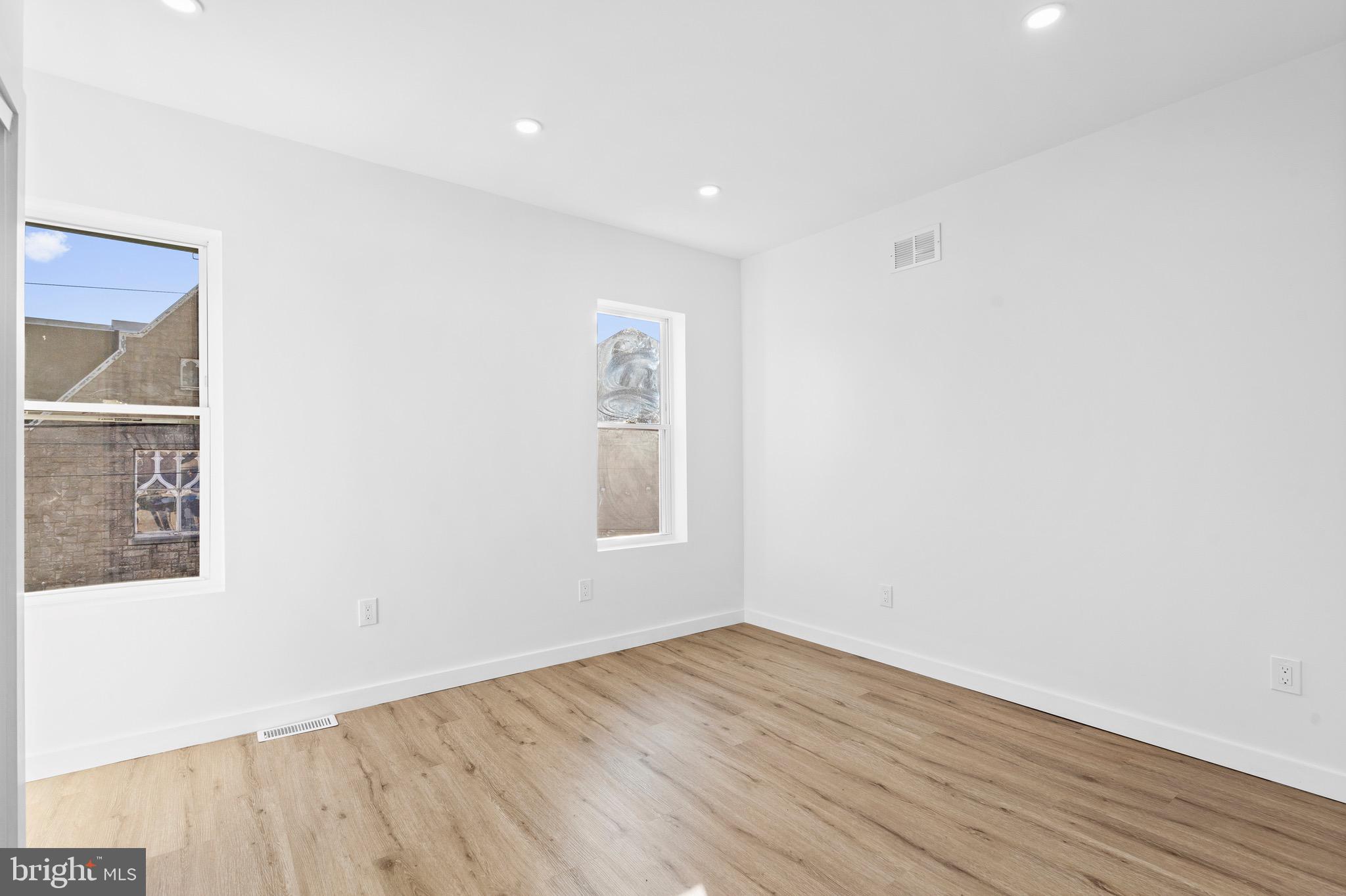 5541 Race Street Philadelphia, PA 19139 - Photo 19 of 37 an empty room with wooden floor and windows