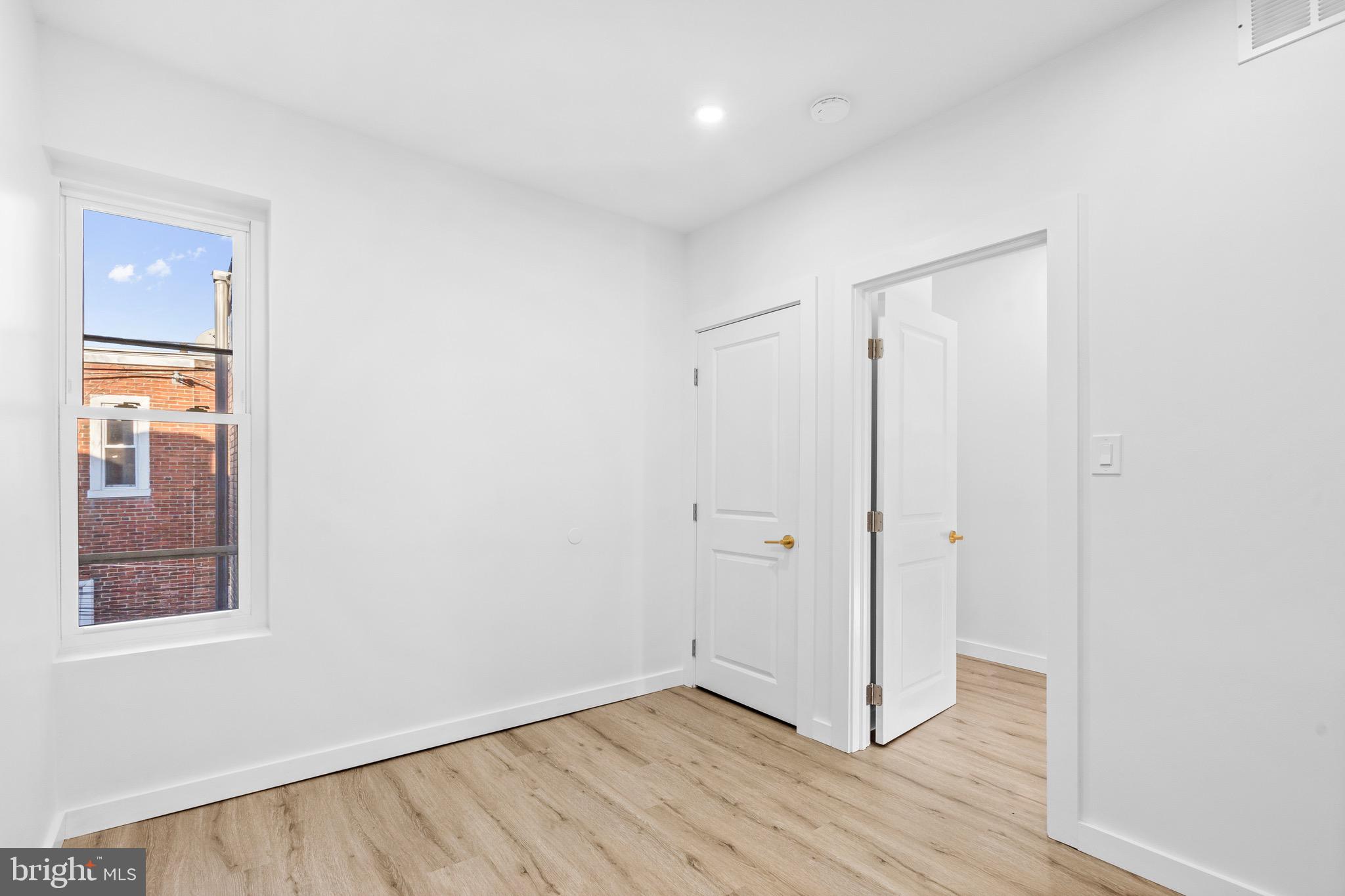 5541 Race Street Philadelphia, PA 19139 - Photo 20 of 37 a view of a hallway with wooden floor and closet