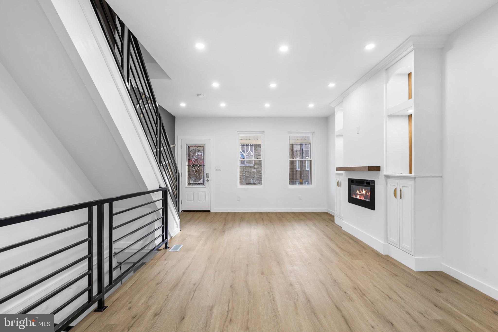 5541 Race Street Philadelphia, PA 19139 - Photo 5 of 37 wooden floor in an empty room with a window