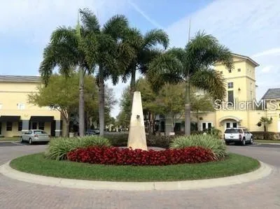 a front view of building with yard and green space