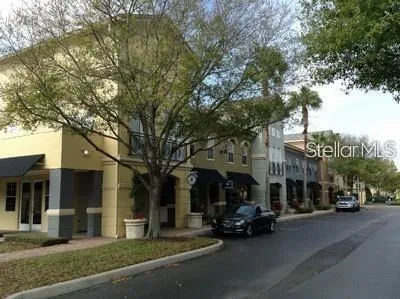 a view of a street in front of residential houses