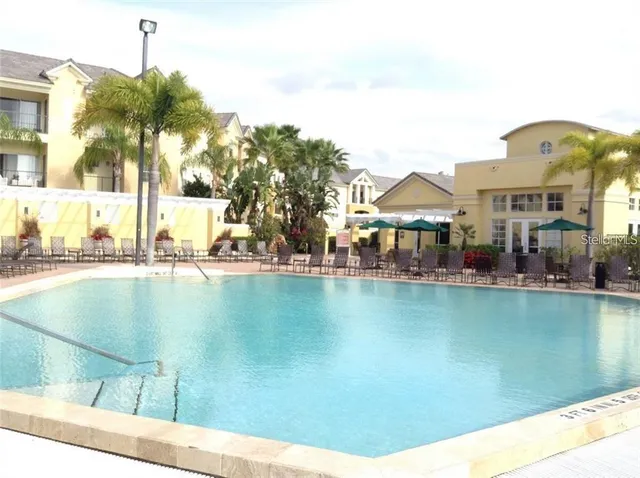 a view of a swimming pool with a lake view