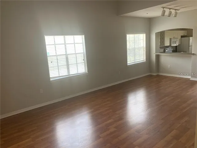 a kitchen with cabinets appliances and a sink