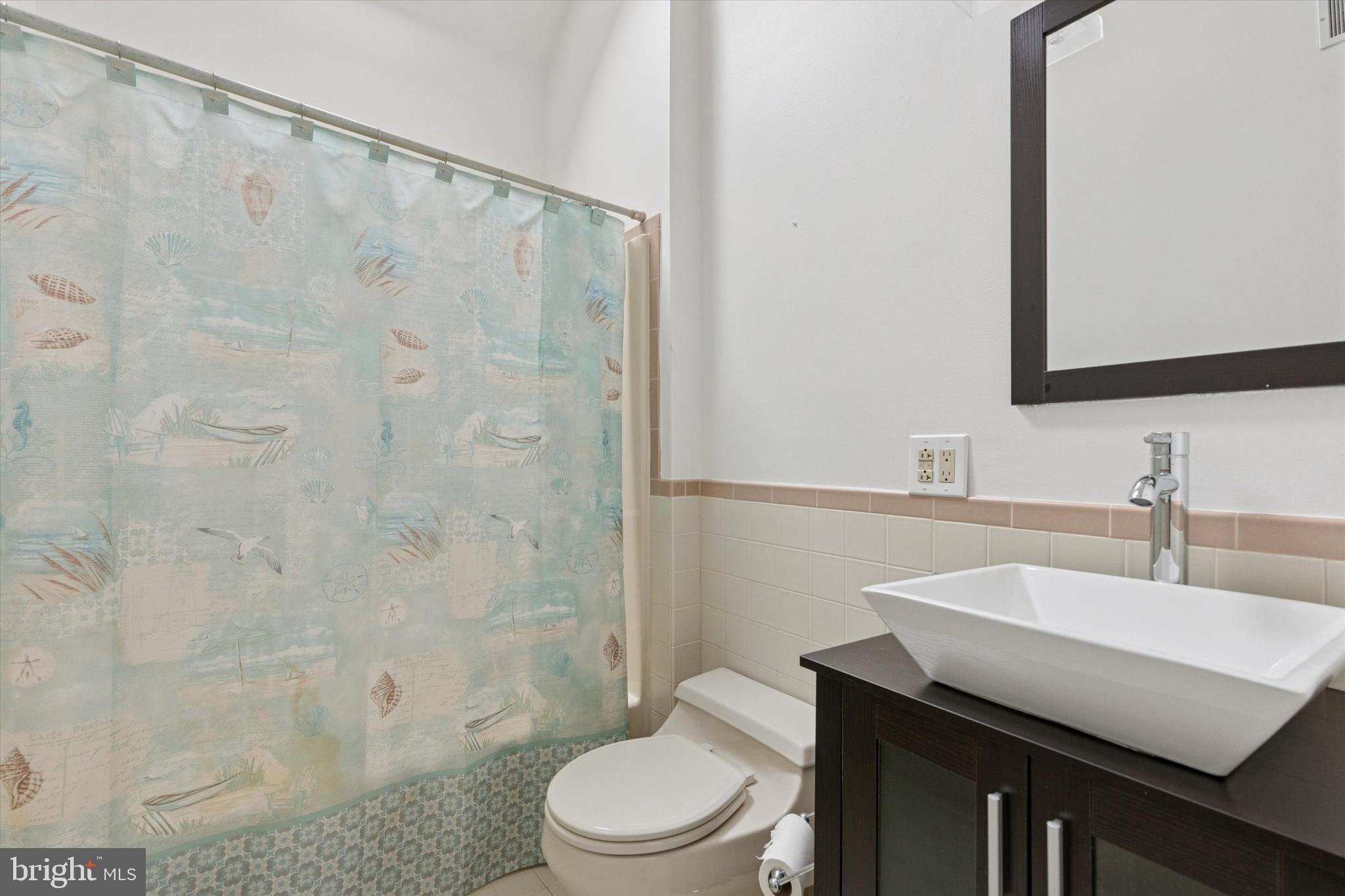134 Yew Road Cheltenham, PA 19012 - Photo 13 of 19 a bathroom with a sink a toilet and shower