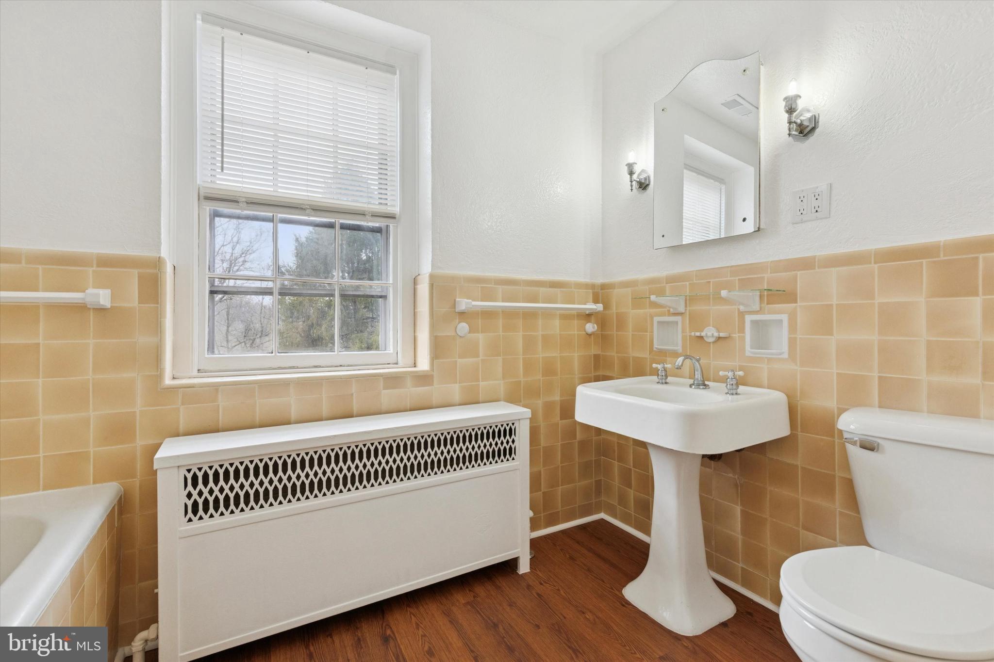 134 Yew Road Cheltenham, PA 19012 - Photo 6 of 19 a bathroom with a sink a toilet and a mirror