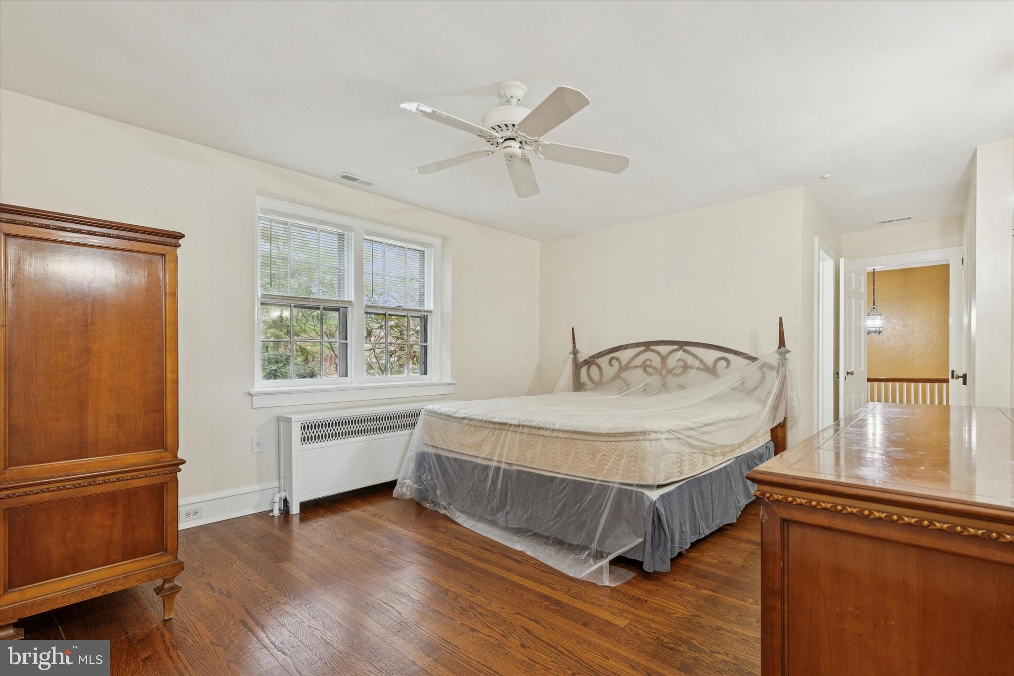 134 Yew Road Cheltenham, PA 19012 - Photo 7 of 19 a spacious bedroom with a bed and window