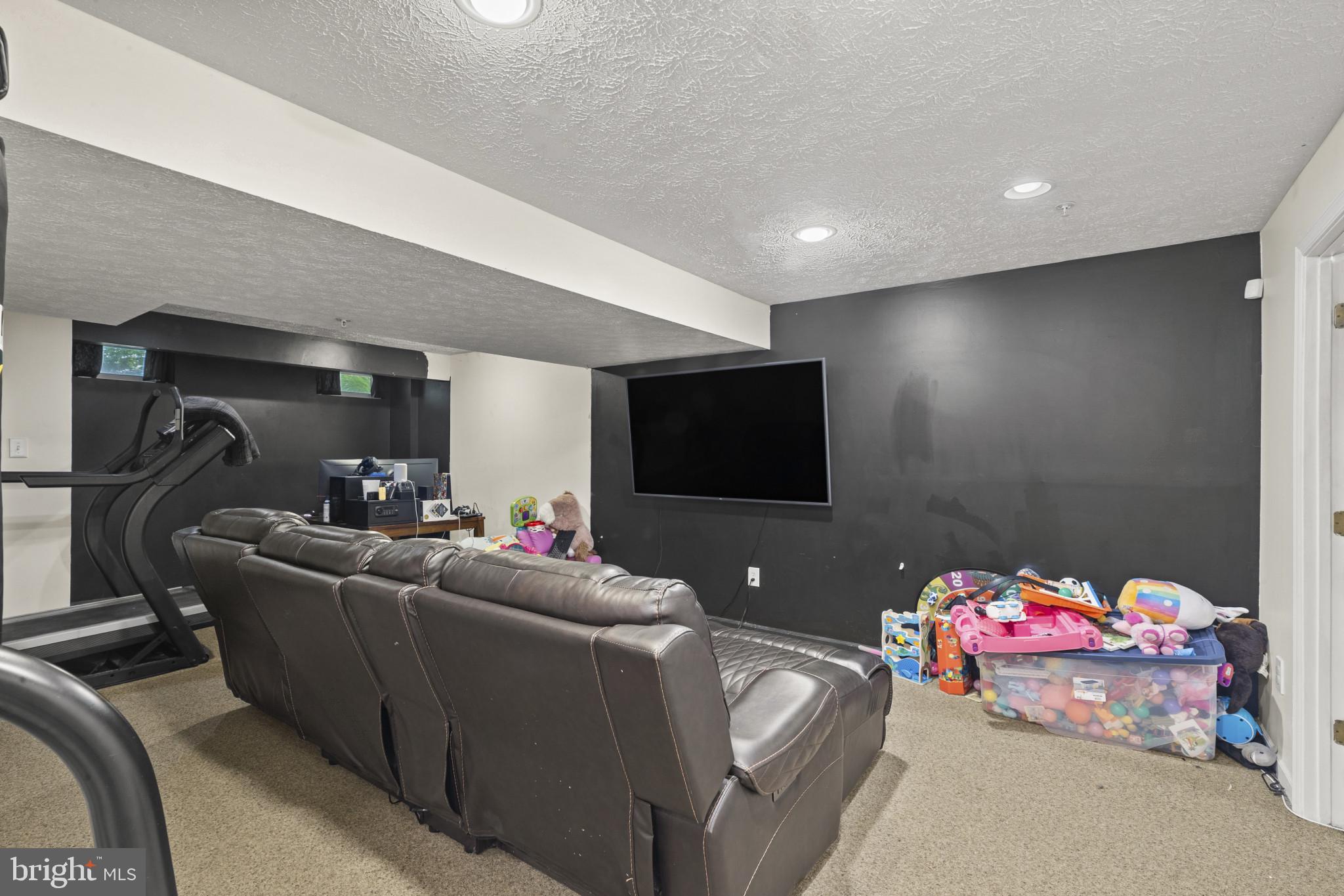2042 Hackberry Road Baltimore, MD 21221 - Photo 14 of 26 a living room with furniture and a flat screen tv
