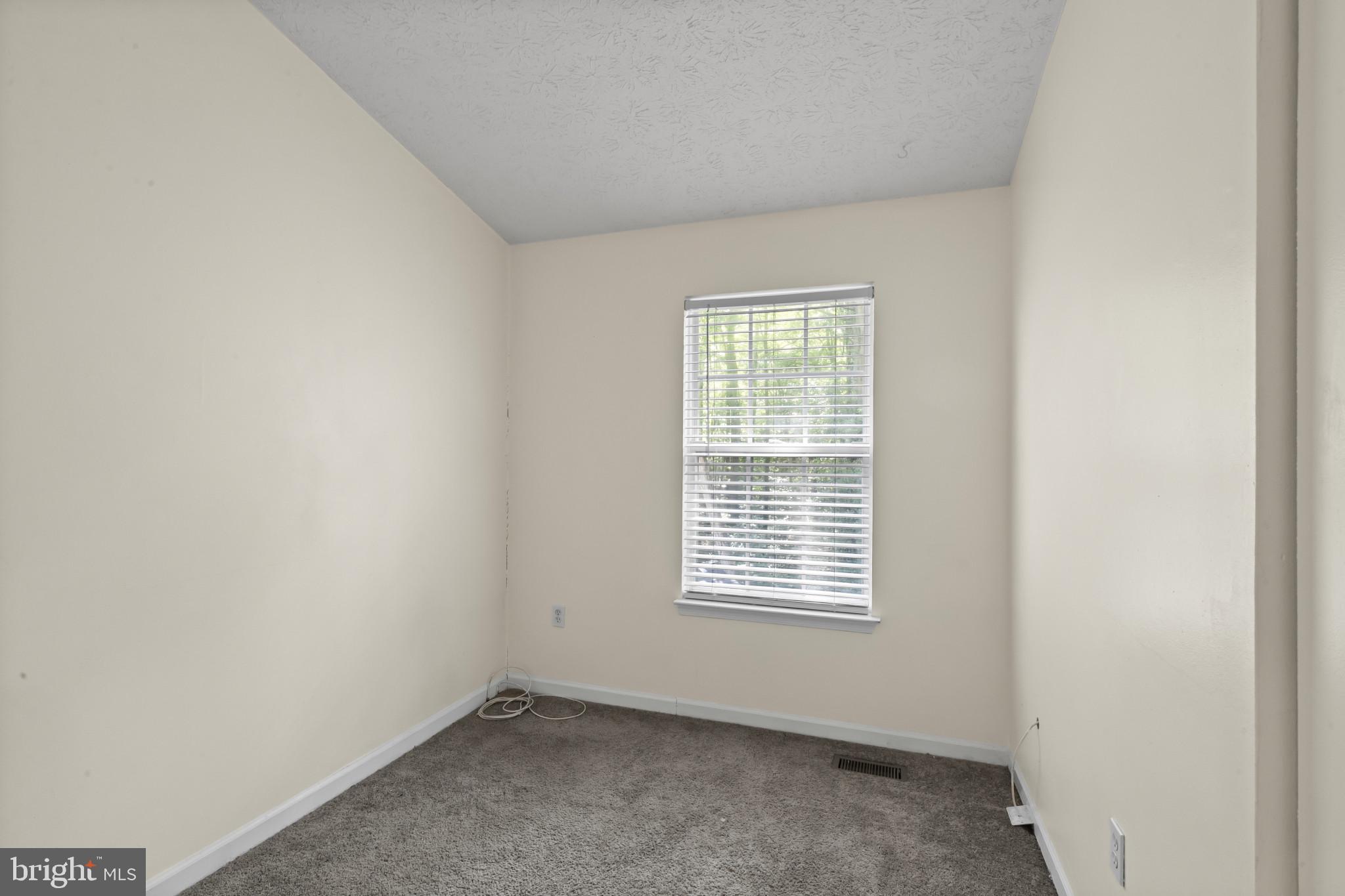 2042 Hackberry Road Baltimore, MD 21221 - Photo 17 of 26 an empty room with a window