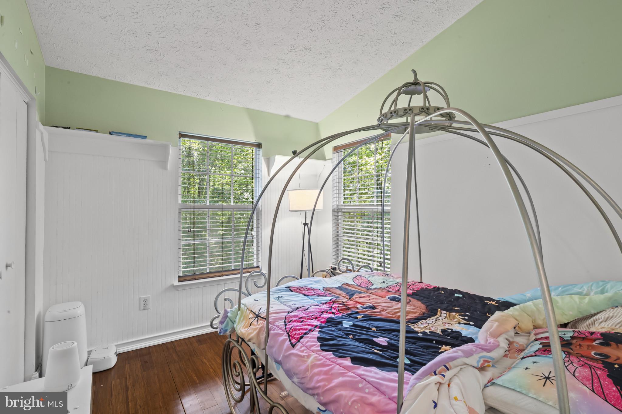 2042 Hackberry Road Baltimore, MD 21221 - Photo 18 of 26 a bed sitting in a bedroom next to a window