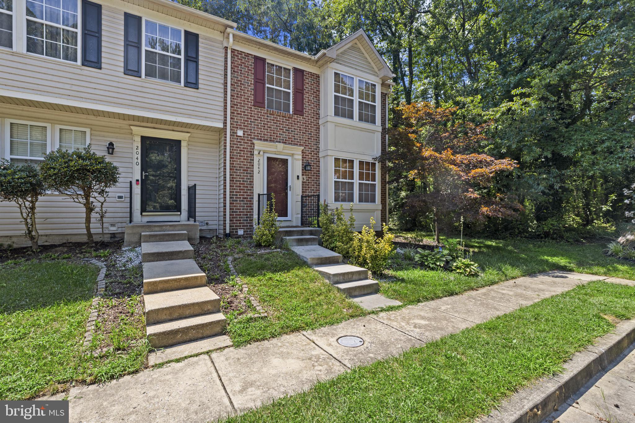 2042 Hackberry Road Baltimore, MD 21221 - Photo 2 of 26 a front view of a house with a yard