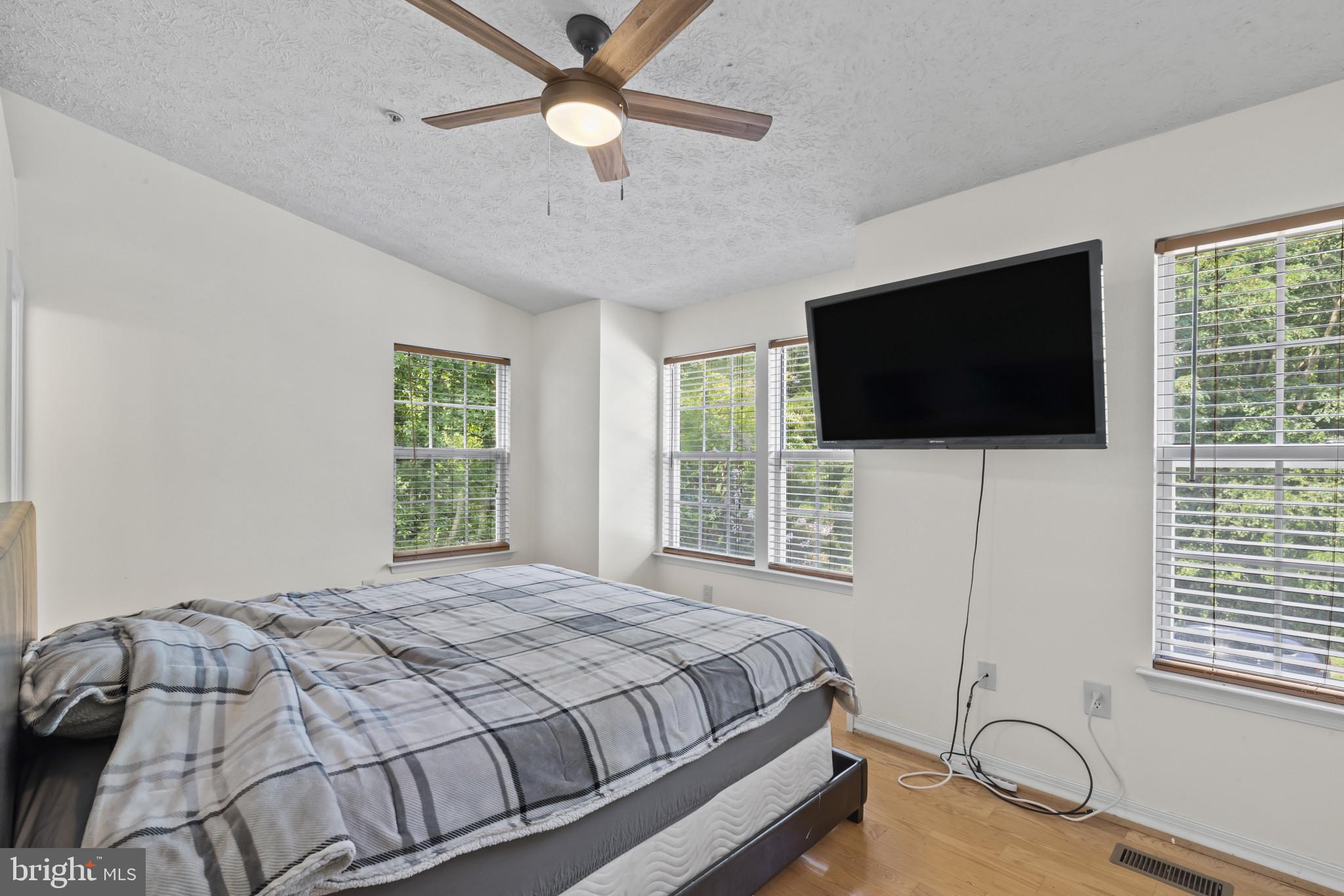 2042 Hackberry Road Baltimore, MD 21221 - Photo 21 of 26 a bedroom with a bed and a flat screen tv