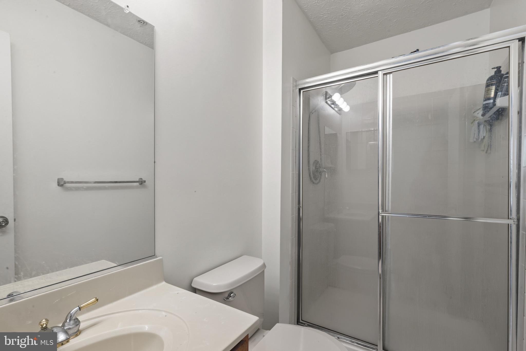 2042 Hackberry Road Baltimore, MD 21221 - Photo 23 of 26 a bathroom with a toilet and a shower