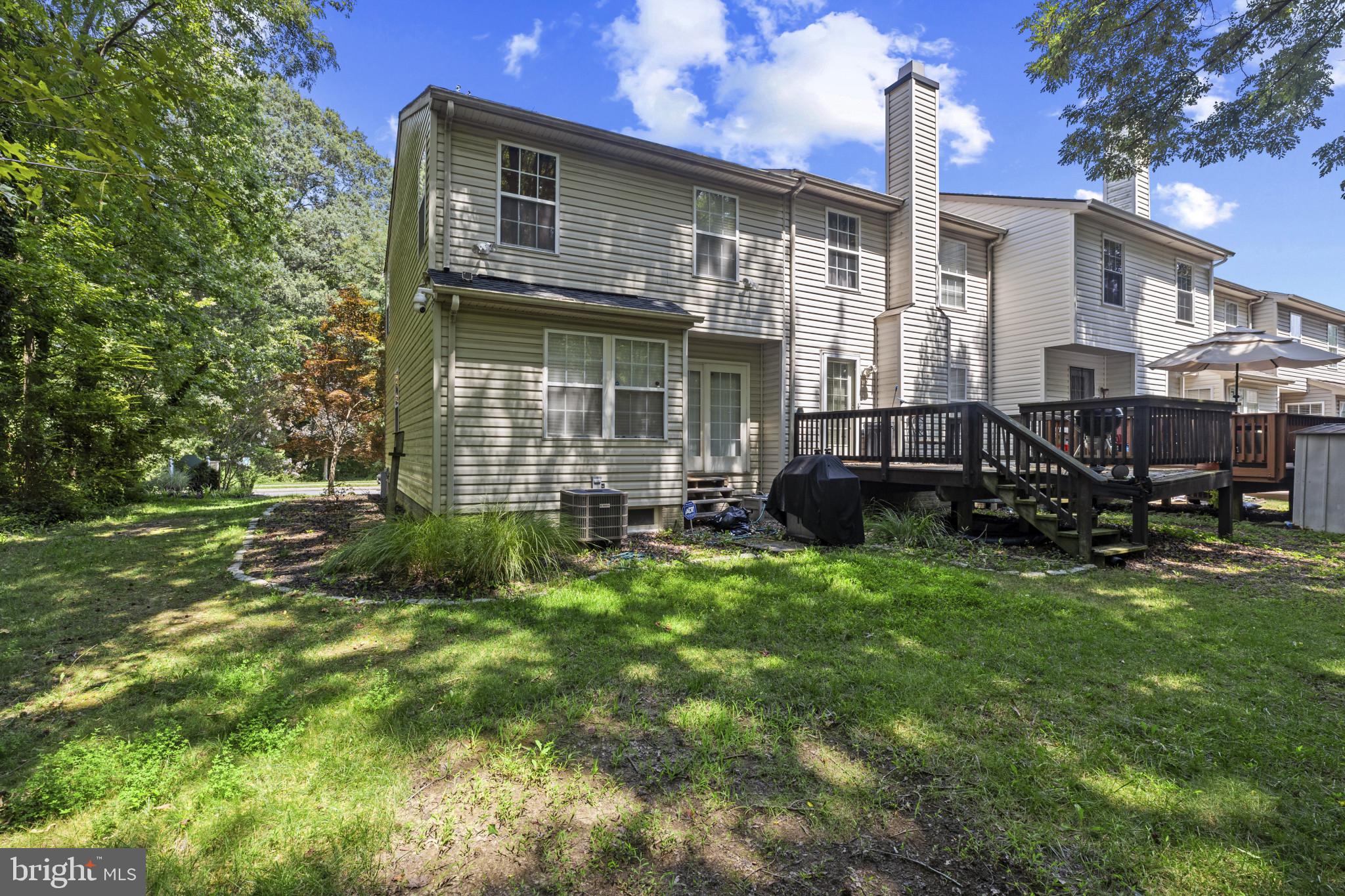 2042 Hackberry Road Baltimore, MD 21221 - Photo 26 of 26 a front view of a house with a garden and chairs