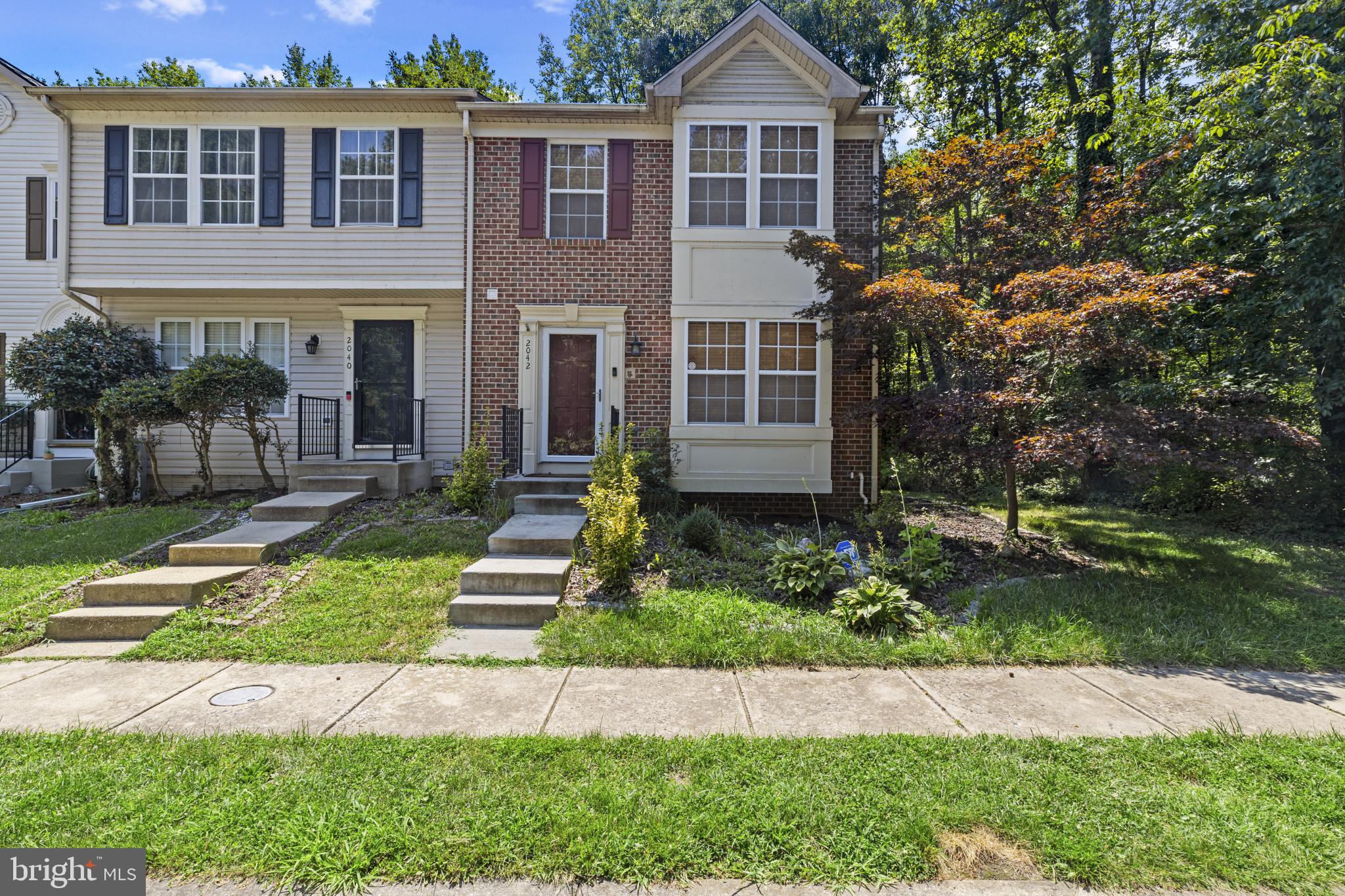 2042 Hackberry Road Baltimore, MD 21221 - Photo 3 of 26 a front view of a house with a yard