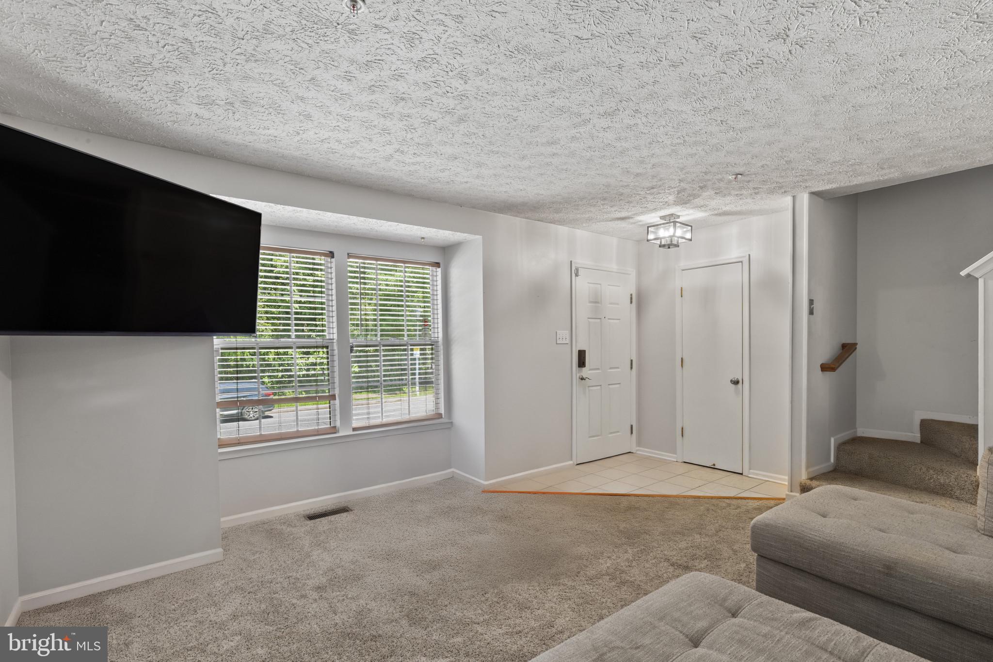 2042 Hackberry Road Baltimore, MD 21221 - Photo 4 of 26 a living room with furniture and a flat screen tv