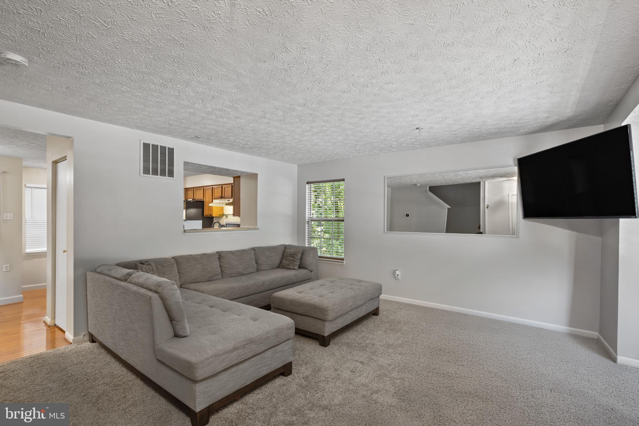 2042 Hackberry Road Baltimore, MD 21221 - Photo 6 of 26 a living room with furniture and a flat screen tv