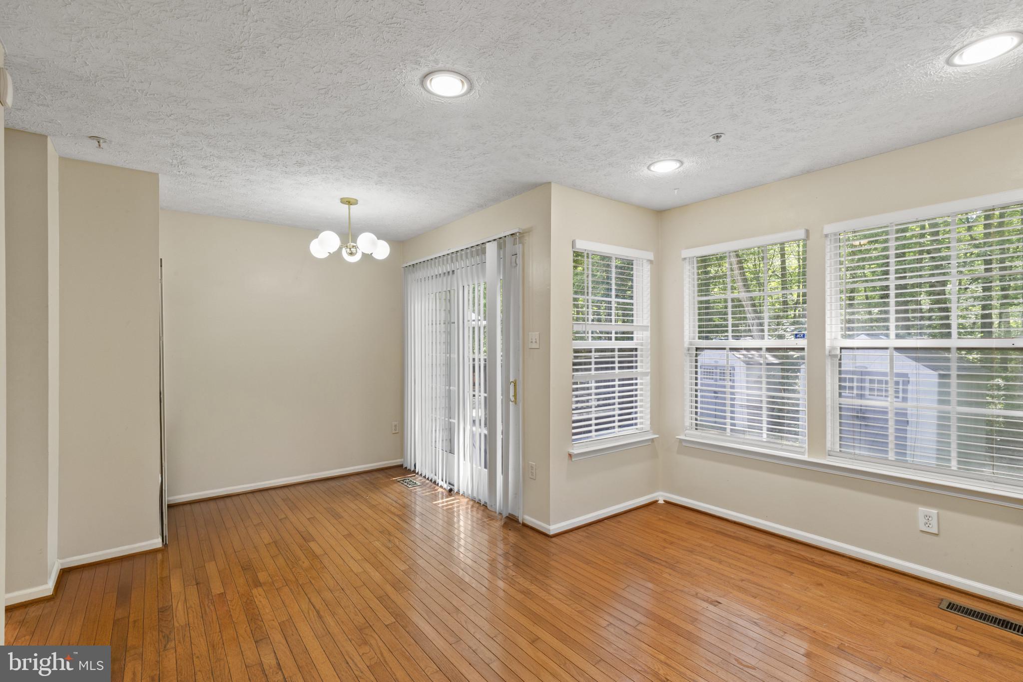 2042 Hackberry Road Baltimore, MD 21221 - Photo 8 of 26 a view of livingroom with hardwood floor and window