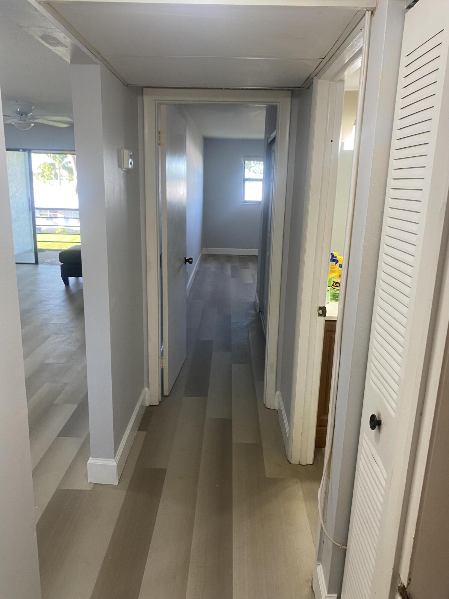 2181 Woolbright Road, Unit N201 Boynton Beach, FL 33426 - Photo 11 of 15 a view of hallway with wooden floor