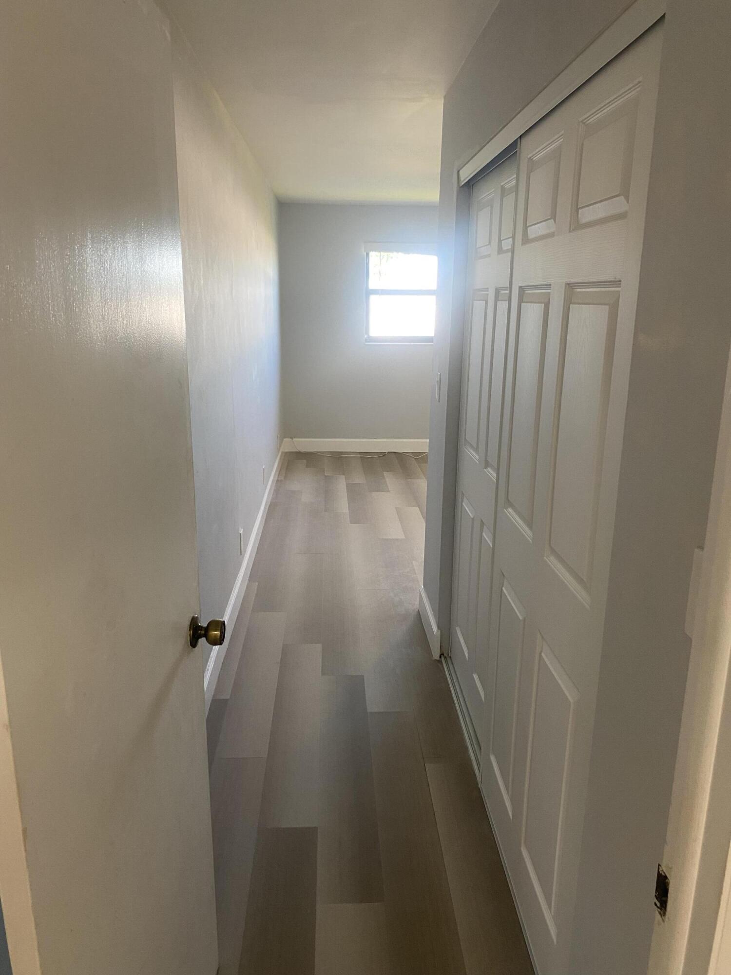 2181 Woolbright Road, Unit N201 Boynton Beach, FL 33426 - Photo 12 of 15 wooden floor in a gallery