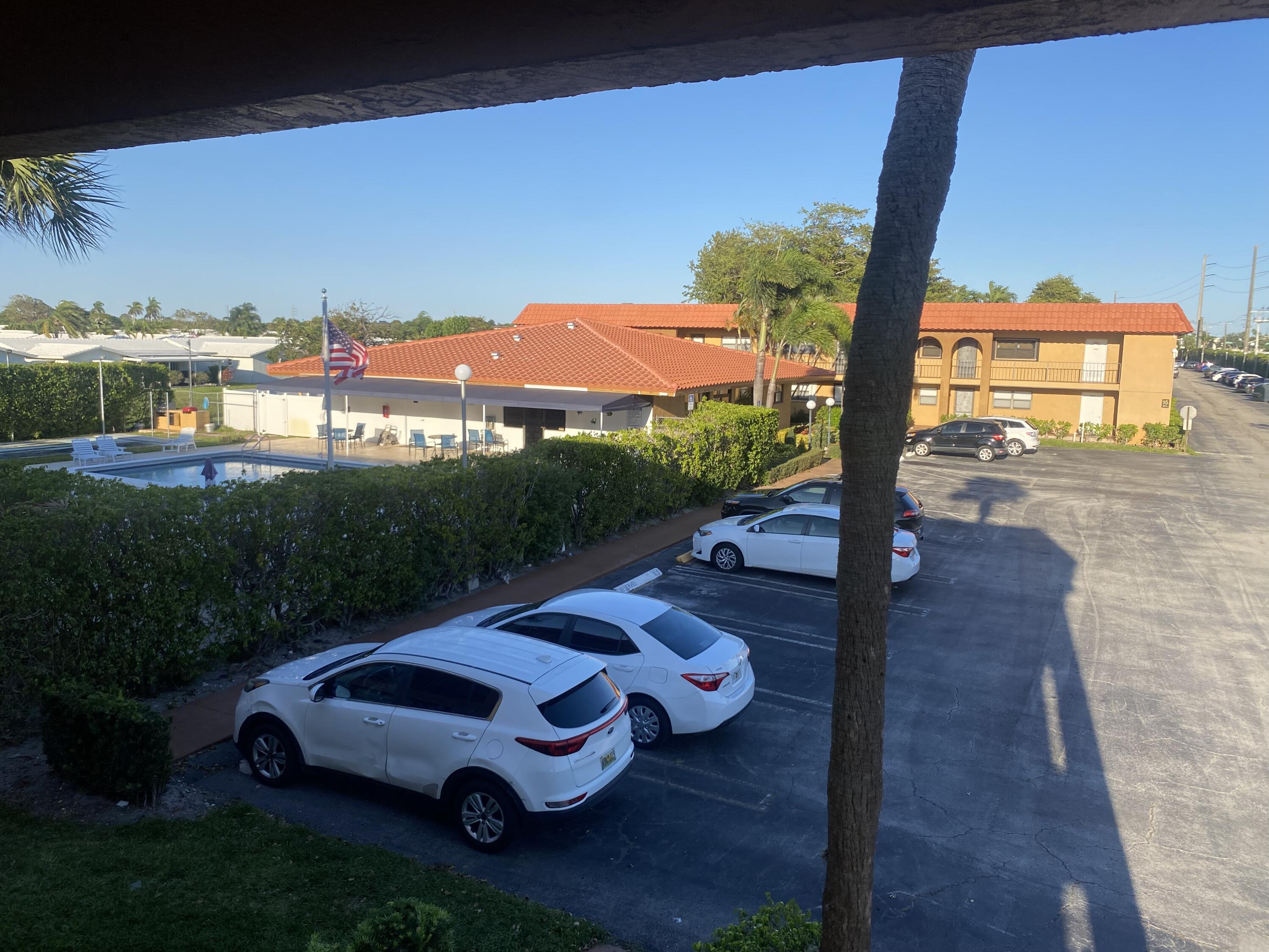 2181 Woolbright Road, Unit N201 Boynton Beach, FL 33426 - Photo 14 of 15 a view of a two chairs in the roof yard