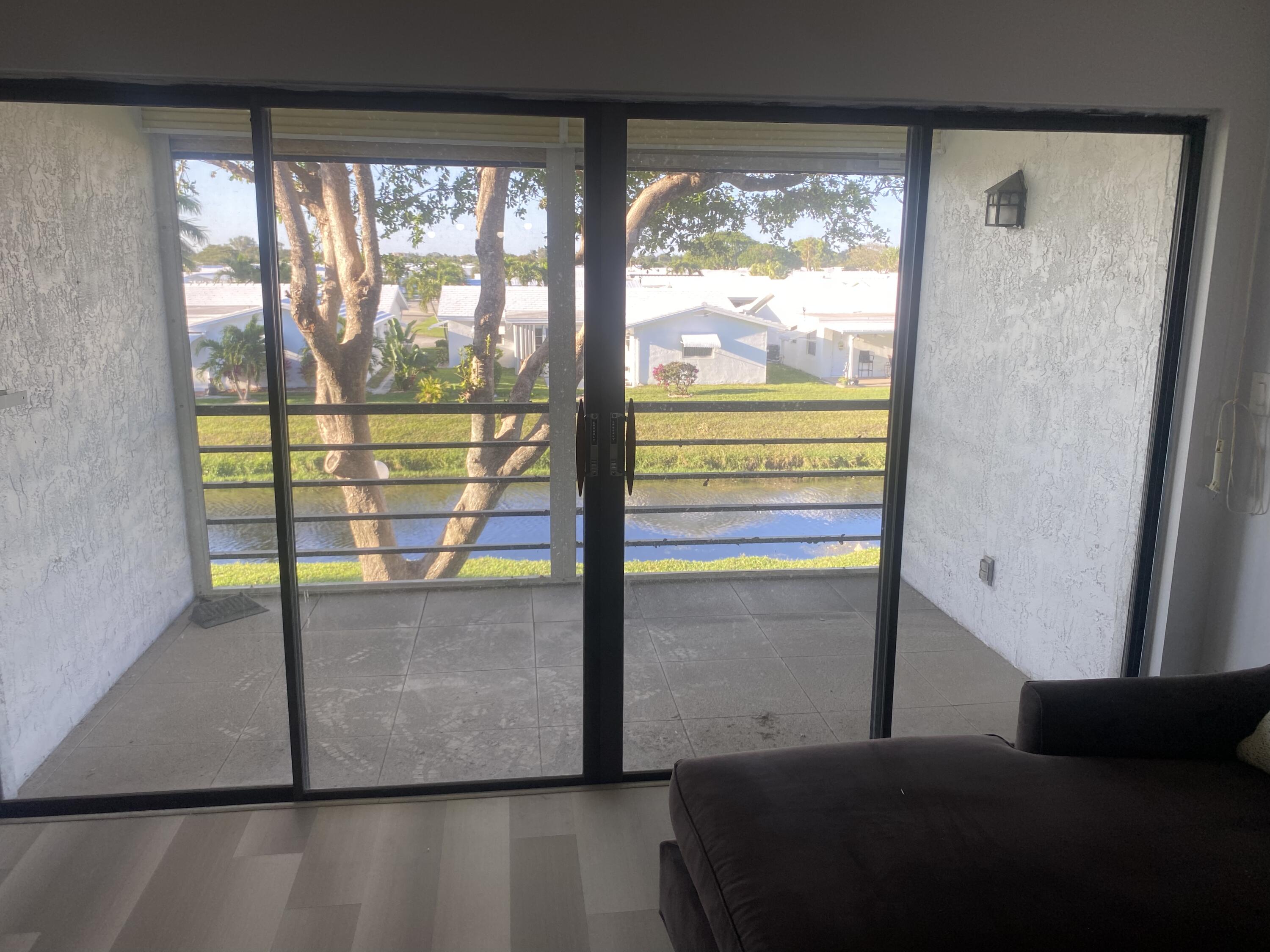 2181 Woolbright Road, Unit N201 Boynton Beach, FL 33426 - Photo 6 of 15 a view of a large window with an outdoor space