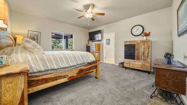 a bed room with a bed and a chair