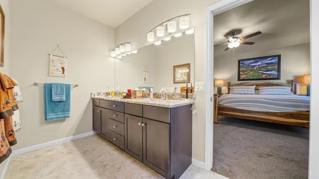 a bathroom with a sink a vanity and a mirror