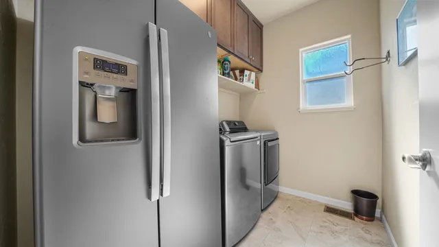 a view of a patio with a table chairs and a backyard
