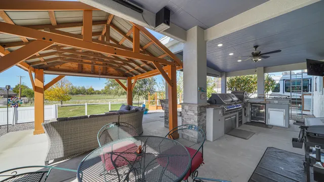 a kitchen with stainless steel appliances granite countertop a stove and a refrigerator
