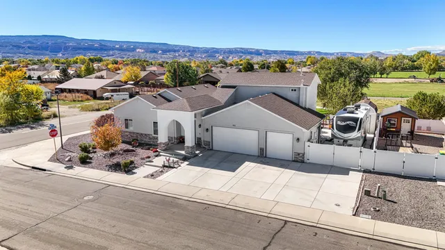 an aerial view of a house with a ocean view