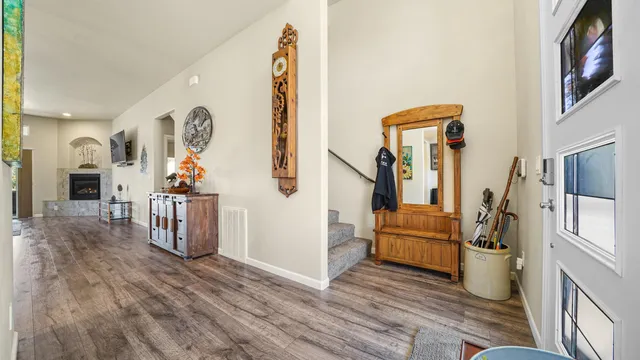 a view of an entryway with wooden floor