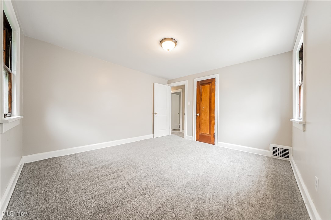 1271 Winston Road Cleveland, OH 44121 - Photo 28 of 43 Carpeted spare room with baseboards