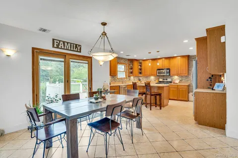 a view of a dining room with furniture window and outside view