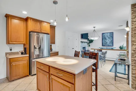 a view of a dining room with furniture and a chandelier