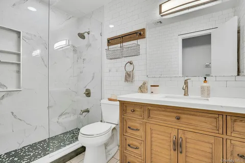 a view of a livingroom with workspace and a window