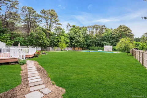 a view of a house with a backyard porch and sitting area